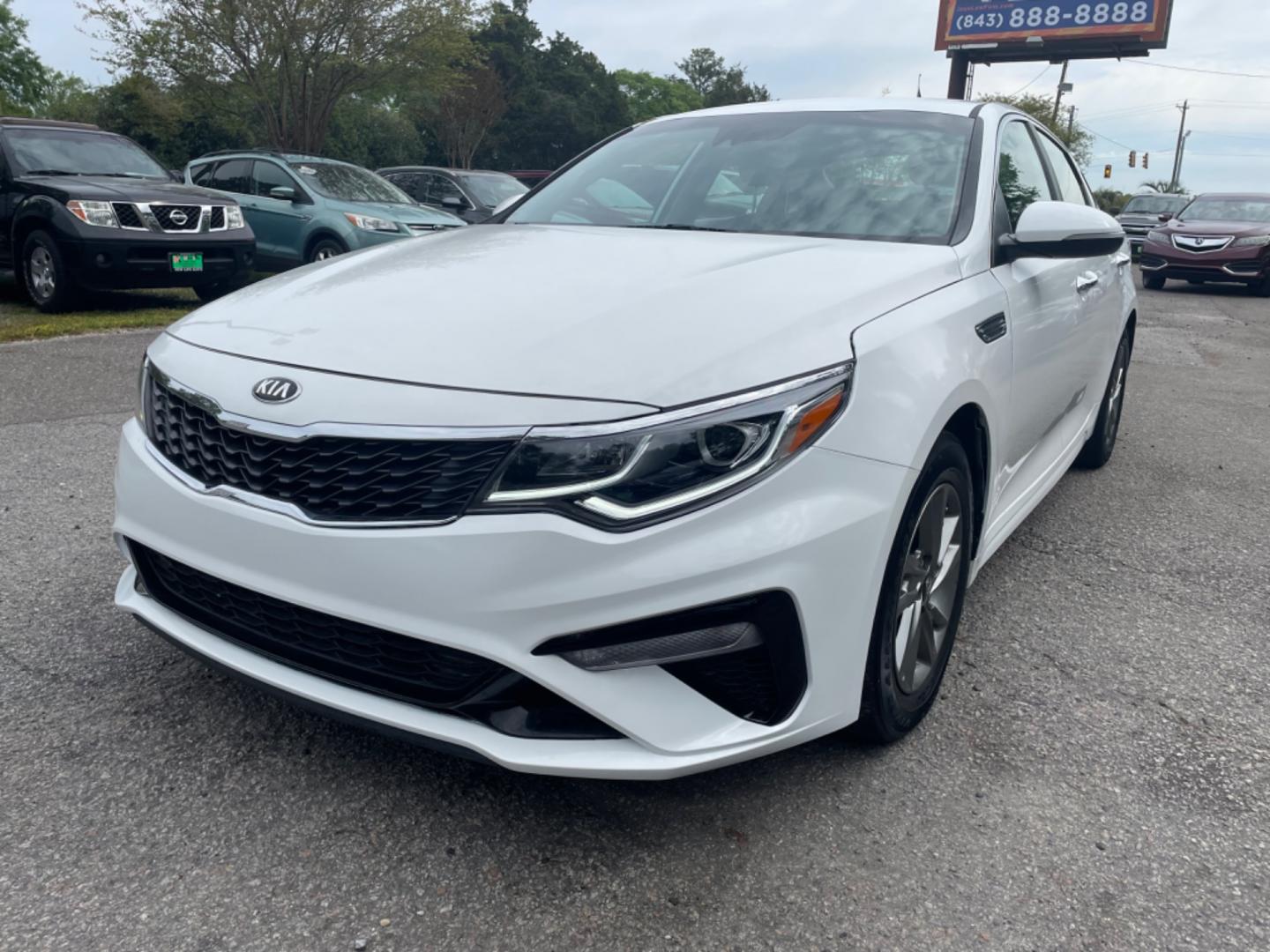 2019 WHITE KIA OPTIMA LX (5XXGT4L38KG) with an 2.4L engine, Automatic transmission, located at 5103 Dorchester Rd., Charleston, SC, 29418-5607, (843) 767-1122, 36.245171, -115.228050 - Spacious interior with AUX/USB/Bluetooth, Backup Camera, Power Windows, Power Locks, Power Mirrors, Keyless Entry, Alloy Wheels. Local Trade-in! 124k miles Located at New Life Auto Sales! 2023 WINNER for Post & Courier's Charleston's Choice Pre-owned Car Dealer AND 2018-2024 Top 5 Finalist for Char - Photo#2